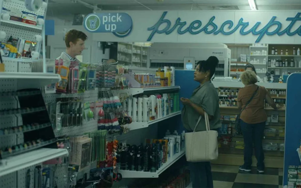 Jesse Burt as Reputed Beaker Lookalike and Tanya Freeman as Woman in Aisle in Peacemaker Season 2